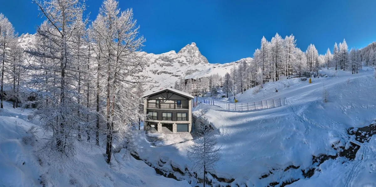 Chalet in deep snow in the Italian Alps
