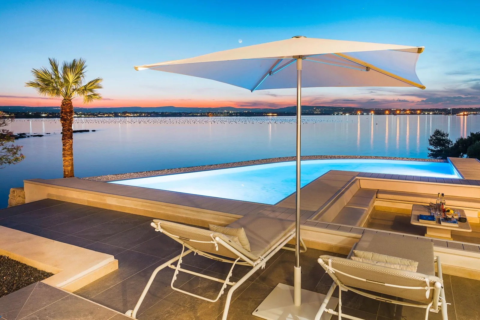 Private waterfront villa with a pool in Italy