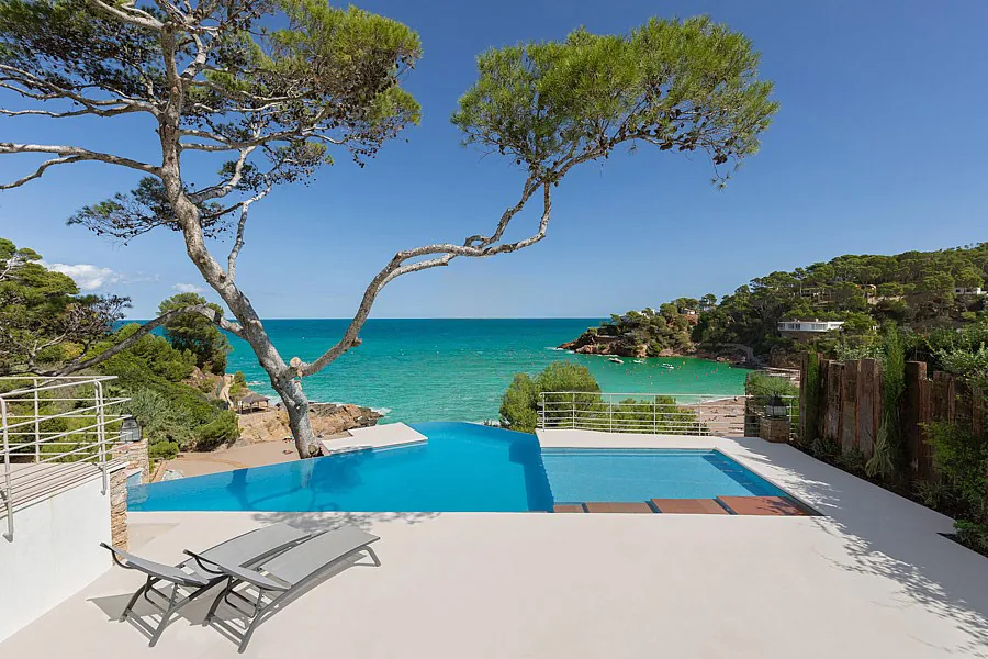Villa with a pool above a Mediterranean cove in Spain